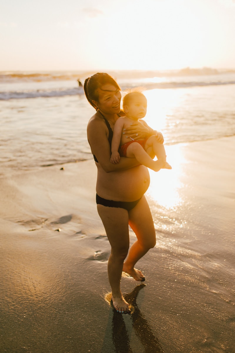 beach maternity photography of mommy and her son