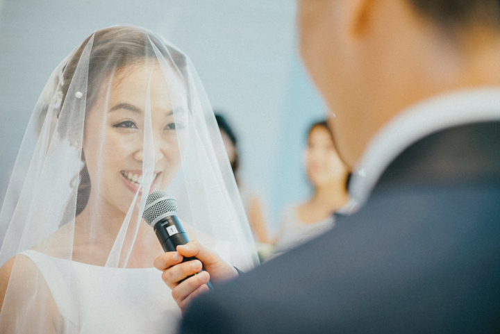 The bride was smiling during her vows wedding at ayana bali resort