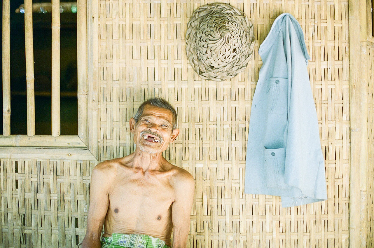 film photography of elderly smiling into the camera
